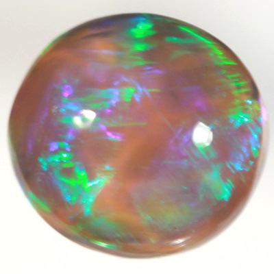 SOLID BLACK CRYSTAL OPAL Rolling flashes of green over purple fire